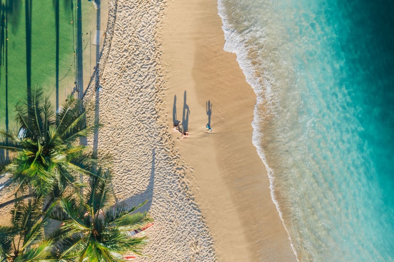 White sand beach meeting turquoise water on a tropical island