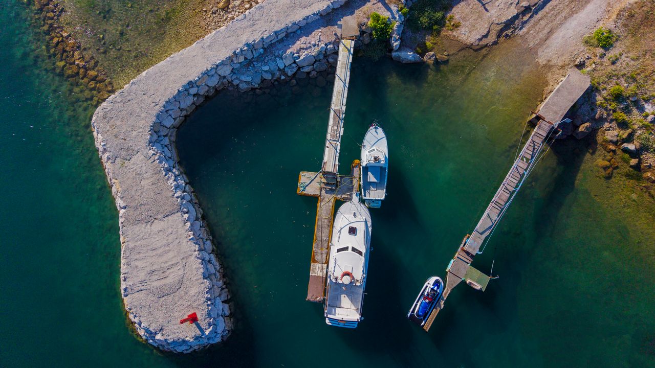 Small private dock extending from shoreline onto foreshore