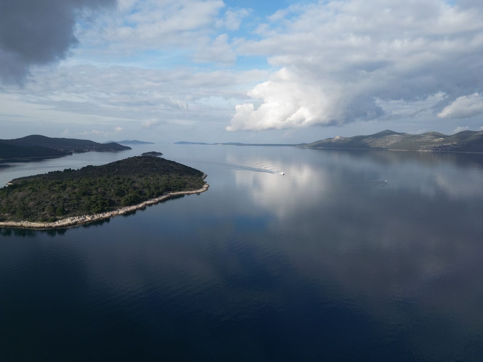 Drone flying over an island conducting a topographical survey